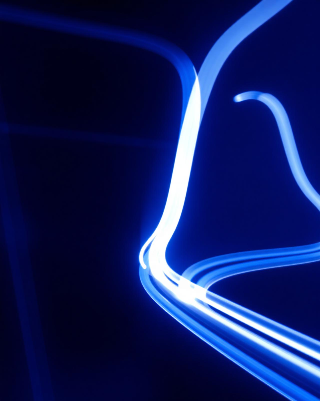 Abstract blue light trails representing financial data flow